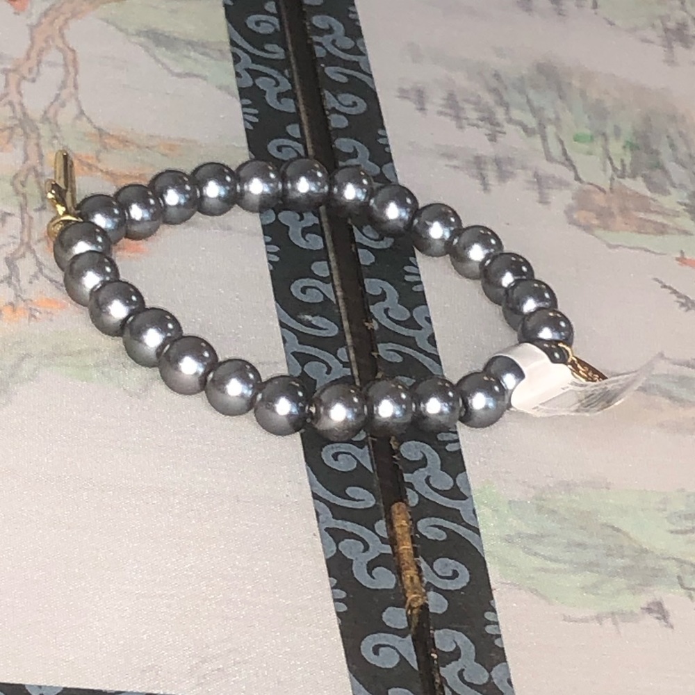 Alexa‘s Angels imitation pearl bracelet with gold tone cross